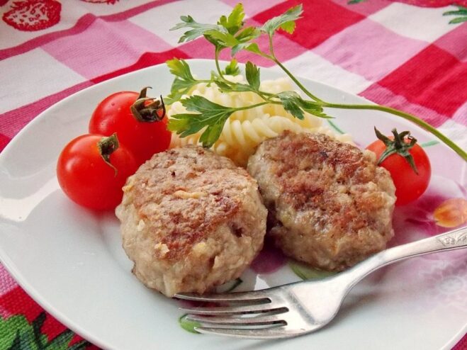 A plate of golden-brown homemade kotlety, ready to be served.