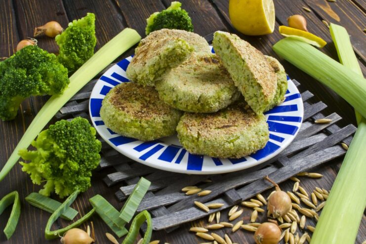 A plate of golden-brown broccoli patties, ready to be served.