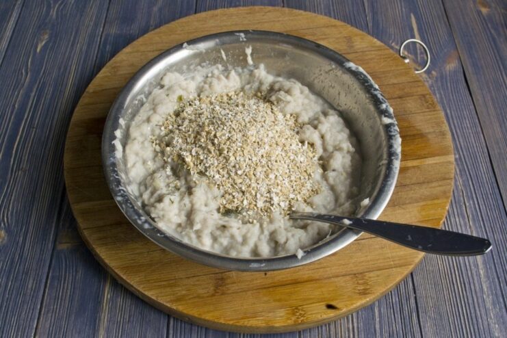 Using oat bran as a binder for fish cakes Oat bran being added to the cod and onion mixture in a bowl.
