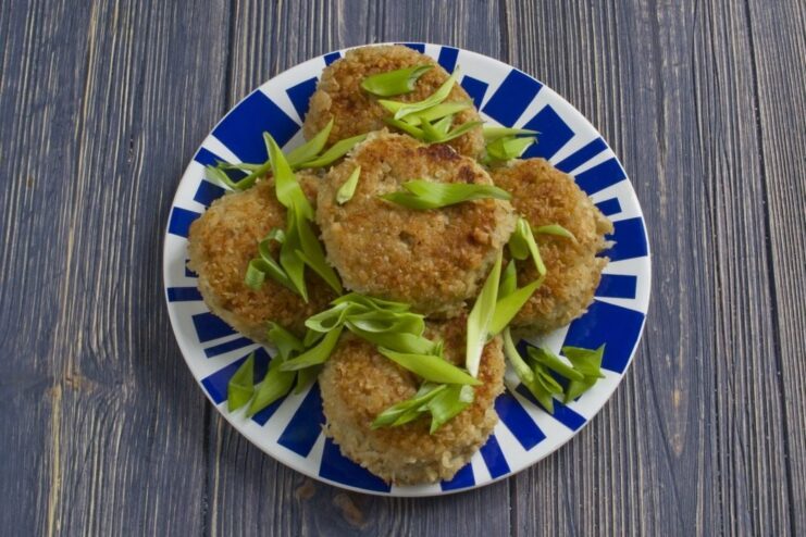 The final dish: delicious cod fish cakes A serving of freshly cooked, golden cod fish cakes on a plate.
