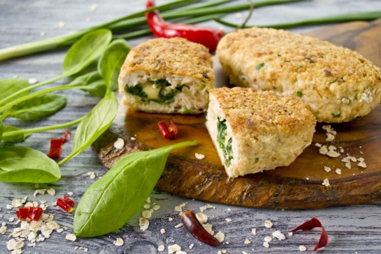 The Final Dish: Juicy Spinach and Cheese Stuffed Chicken Cutlets Finished chicken breast cutlets with spinach and cheese served on a plate.