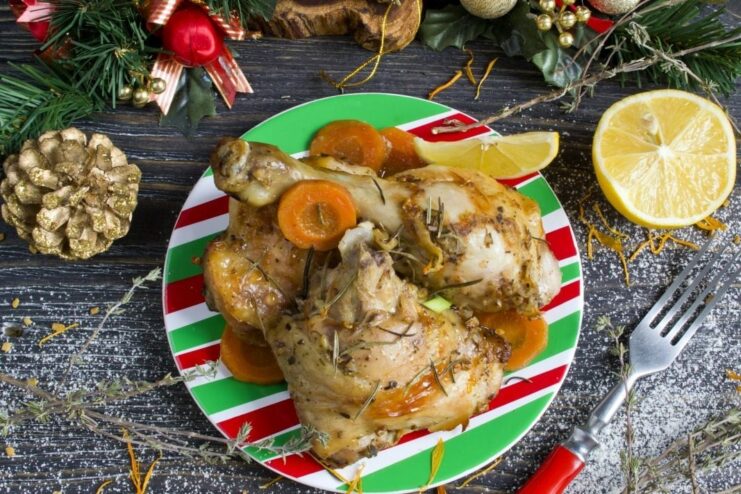 Delicious and juicy chicken baked in an oven bag, ready to serve. A plate of golden-brown chicken baked in an oven bag, garnished with herbs.