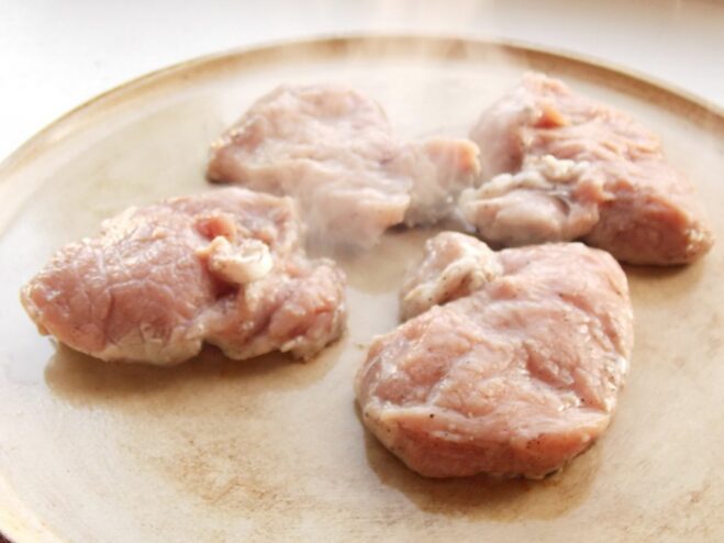Step 3: Searing the pork medallions until golden brown Pork medallions being pan-fried in a hot non-stick skillet.