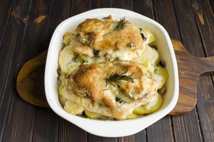 The Final Dish: Golden-Brown French-Style Chicken Bake The finished French-style chicken with mushrooms and potatoes, baked to a golden brown in a dish.