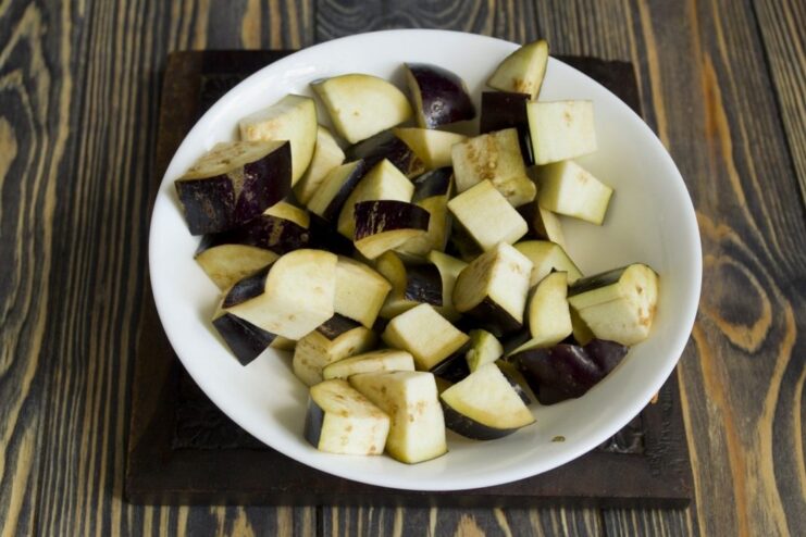 How to properly slice eggplants for roasting Eggplants being cut into uniform pieces for the vegetable ragout.
