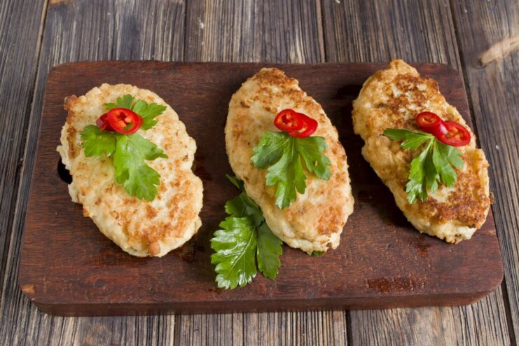 The Final Dish: Juicy and Tender Pollock Fish Cakes A close-up of cooked pollock fish cakes on a serving dish.