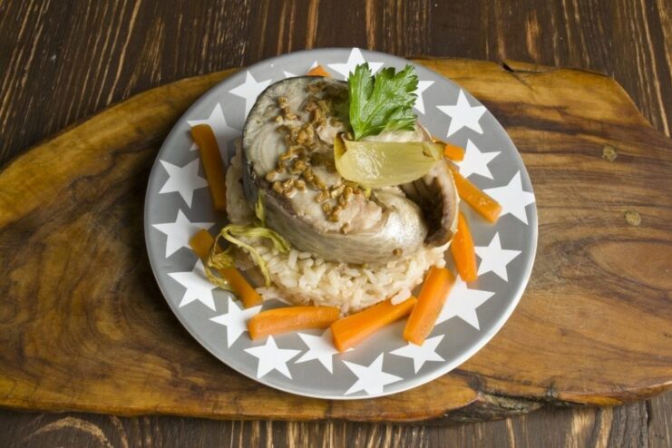 Final Dish: Baked Tuna with Brown Rice and Veggies A beautifully plated dish of baked tuna steak on a bed of brown rice with vegetables.