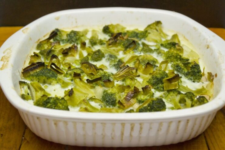 Final Touch: Topping with Sautéed Leeks Before Baking Sprinkling sautéed leeks over the uncooked casserole in the baking dish.