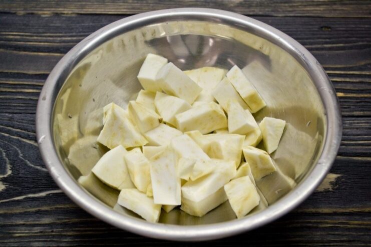 Step 1: Boiling the Celeriac to Soften it for the Gnocchi Dough Diced celeriac boiling in a pot of water on the stove.