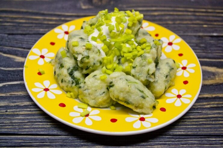 The Finished Dish: Tender Gnocchi with Celery, Spinach, and Potato A close-up shot of the finished celery and spinach gnocchi in a bowl.