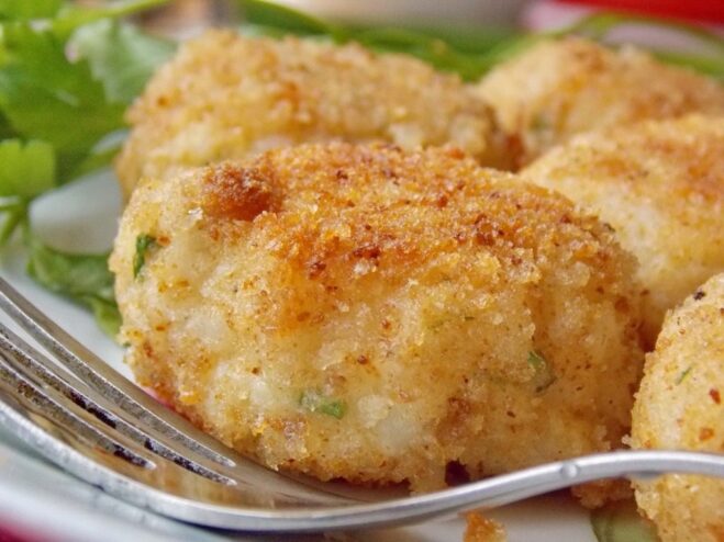 Ready-to-eat Celery and Rice Patties A serving of freshly cooked celery and rice patties on a decorative plate.