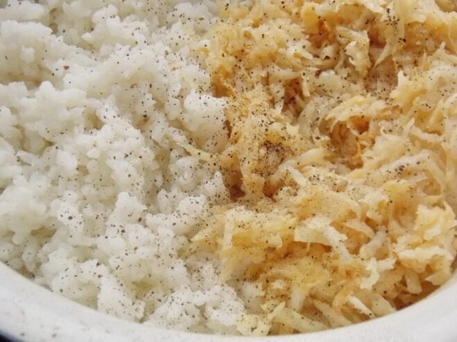 Combining cooked rice and sautéed celery in a bowl A bowl containing a mixture of cooked white rice and sautéed celery.