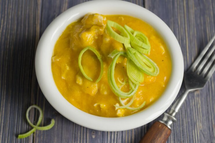 The Finished Chicken and Pumpkin Stew, Ready to Serve A close-up of the finished, creamy chicken and pumpkin stew in a pot.