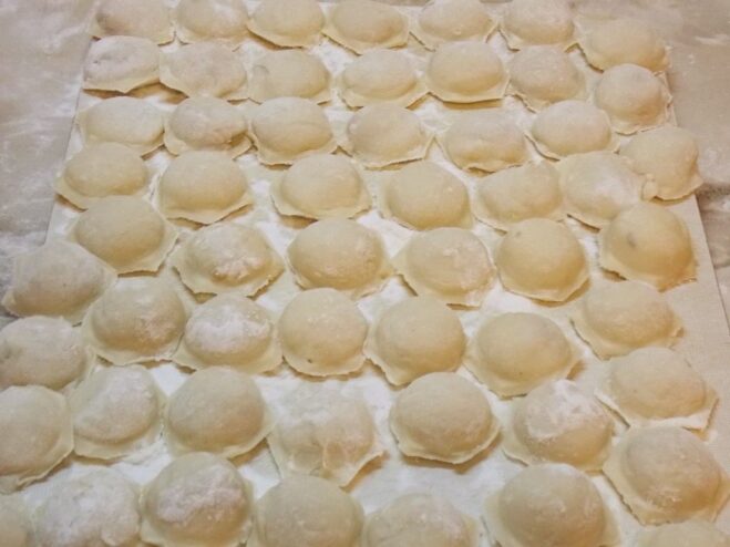 Perfectly Uniform Pelmeni Made Easy A batch of uniform, hexagon-shaped pelmeni made using a pelmennitsa mold.
