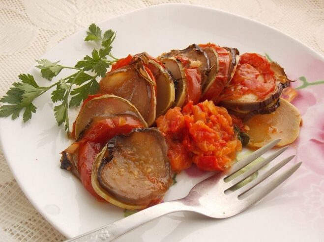 Enjoy a Delicious and Healthy Plate of Ratatouille A close-up shot of a serving of colorful Ratatouille on a plate, ready to eat.