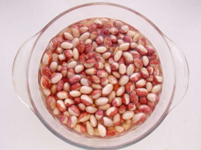 Soaking Beans: The First Step to Tenderness Dry beans soaking in a clear glass bowl of water.