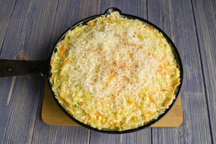 The Final Touch: Topping with Grated Cheese and Paprika Grated cheese and a sprinkle of paprika spread over the casserole mixture in the skillet before baking.