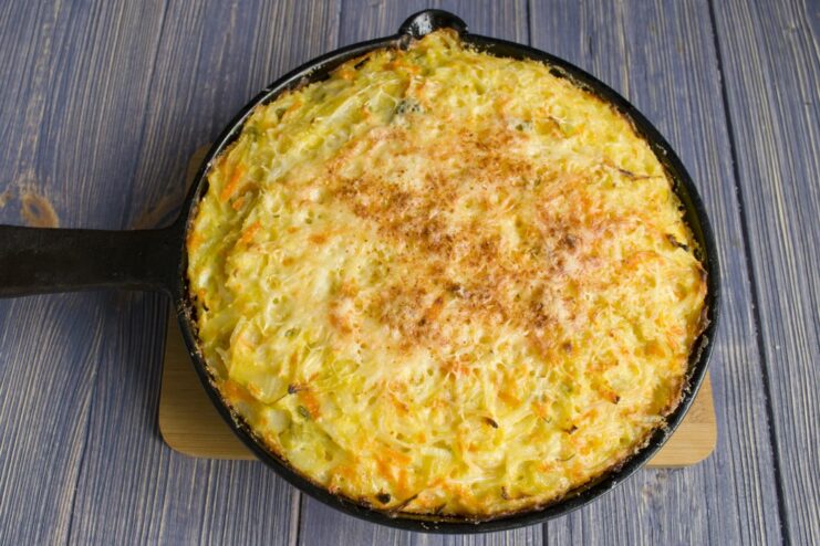 Baking to Golden Perfection: The Casserole in the Oven The pasta and tvorog casserole baking in the oven until golden brown.