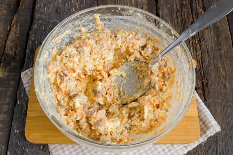 Combining all ingredients into a homogeneous filling All filling ingredients for the deviled eggs being mixed together in a bowl.