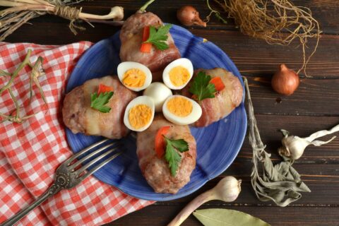 Cheese-Stuffed Cutlets Baked in Bacon