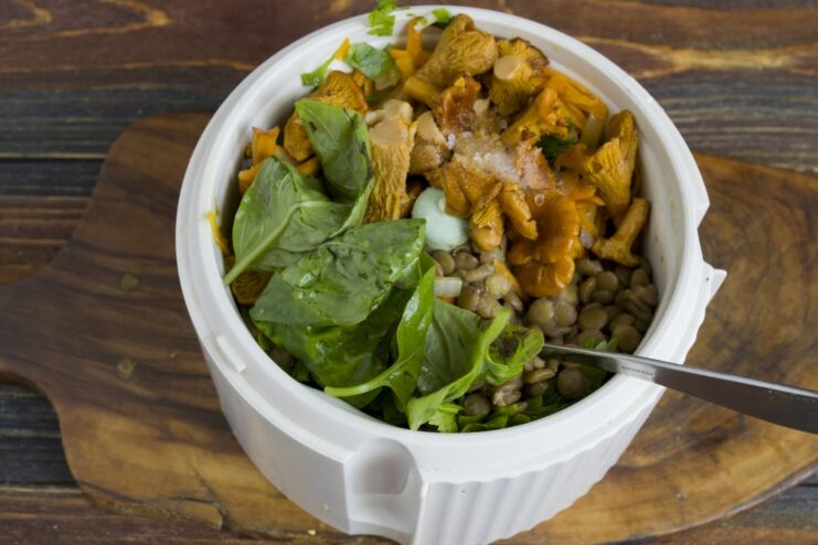 Combining all cooked ingredients for the cutlet mixture Cooked lentils, mushrooms, sautéed vegetables, and fresh basil in a blender bowl.