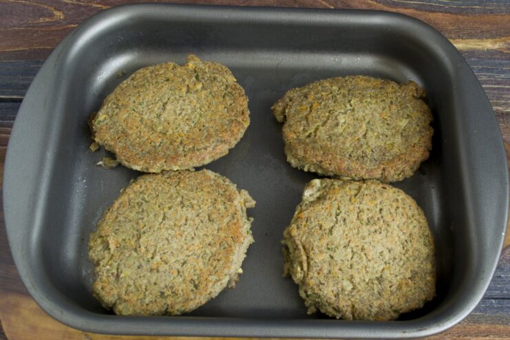 Baking the cutlets until golden brown and delicious The baking dish with lentil cutlets inside a hot oven.