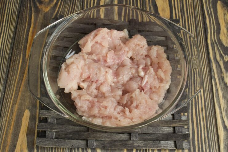 A bowl of freshly ground chicken meat, the base for the kotlety.