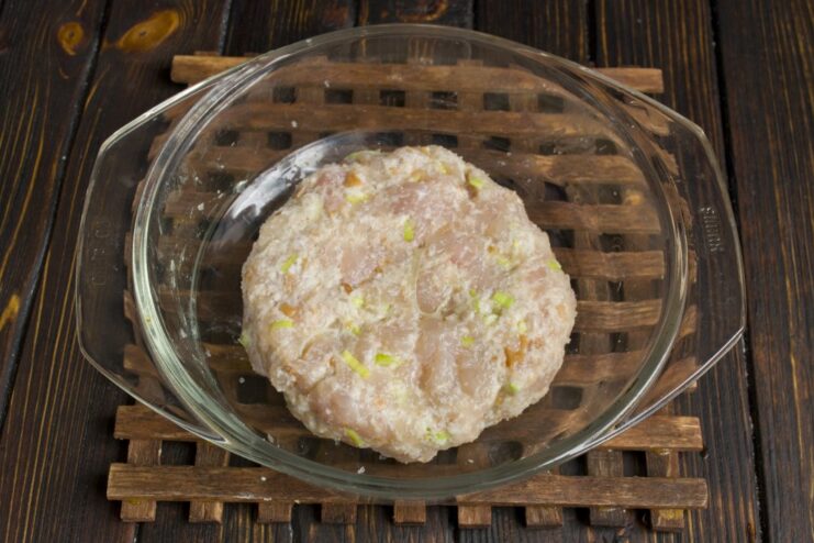 How to Shape Perfect, Even-Sized Kotlety Patties Hands shaping the minced meat mixture into large, flat patties.