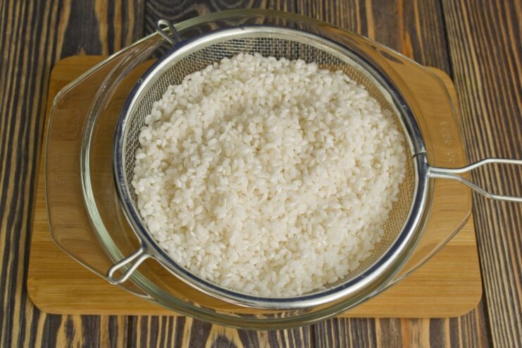 Cooking short-grain rice until perfectly fluffy A saucepan with cooked short-grain rice.