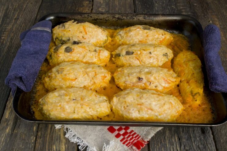 Step 7: Bake the lazy cabbage rolls until cooked through The baking dish with lazy cabbage rolls cooking in a bubbling tomato sauce in the oven.