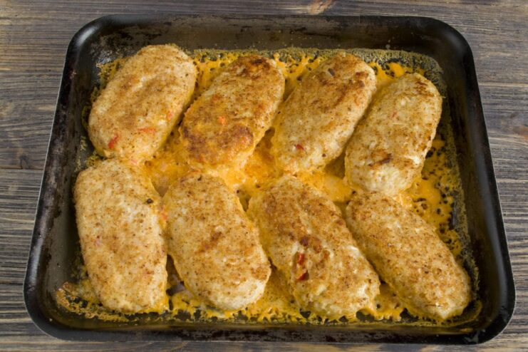 Baking the Lazy Cabbage Rolls to Perfection The baking dish with lazy cabbage rolls in tomato sauce inside a hot oven.