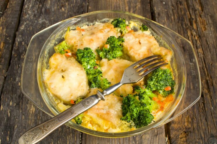 The Final Dish: Baked Pollock with Vegetables Ready to Serve A close-up of the finished baked pollock with vegetables in a dish, ready to be served.