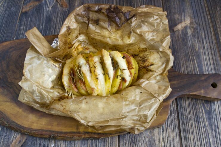 The Final Result: Perfectly Baked Accordion Potato A golden-brown baked accordion potato with melted cheese, ready to be served hot.