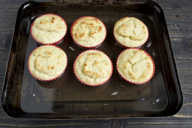 Baking the Fish Soufflé in a Water Bath Soufflé molds in a roasting pan with water, baking inside an oven.