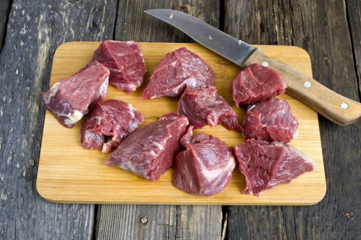 Preparing the Beef: Cubing Tenderloin for Shashlik Cubes of beef tenderloin being prepared for marinating, with fat trimmed off.
