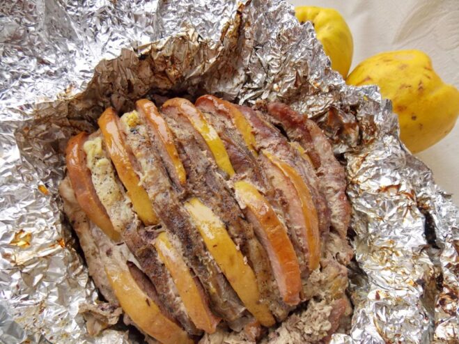 Unwrapping for a Perfectly Golden-Brown Crust The foil is opened to expose the top of the cooked pork, ready for final browning.
