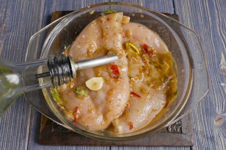 Adding olive oil to the chicken marinade before refrigerating.