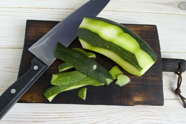 Preparing Zucchini for the Patties A peeled zucchini being diced into cubes to be added to the meat mixture.