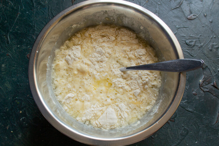 Step-by-step guide to making smooth crepe batter. Mixing ingredients for crepe batter in a glass bowl.