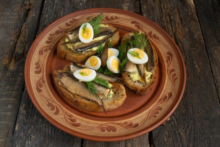 The Finished Sprat Sandwiches Ready to Serve A close-up of the finished sprat sandwiches on a plate, ready to be served.