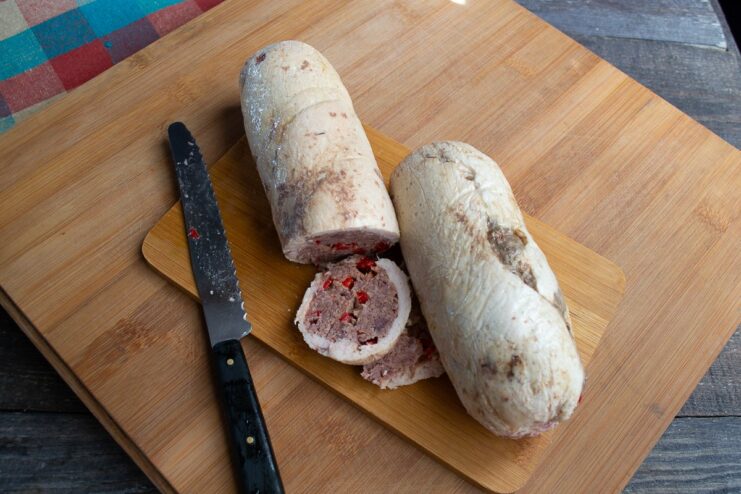 Chilling the Cooked Beef and Chicken Roll The finished beef and chicken roll, sliced and ready to be served.