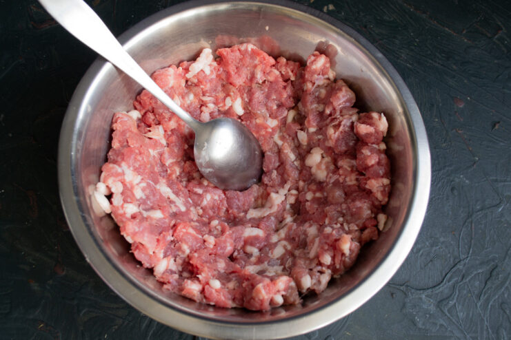 Preparing the Ground Meat Mixture for Sausages A bowl of freshly ground meat for making homemade sausages.