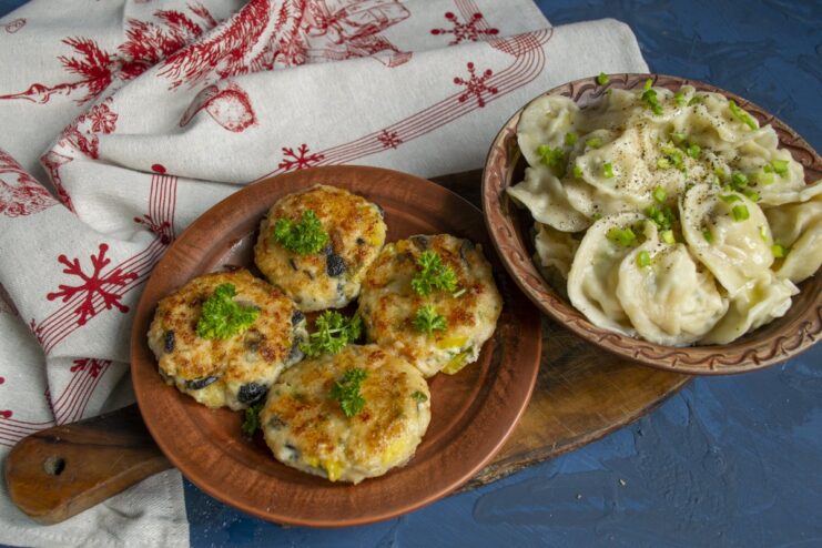 The Finished Dishes: Pelmeni and Kotlety A final presentation of cooked pelmeni and kotlety on a plate, ready to serve.