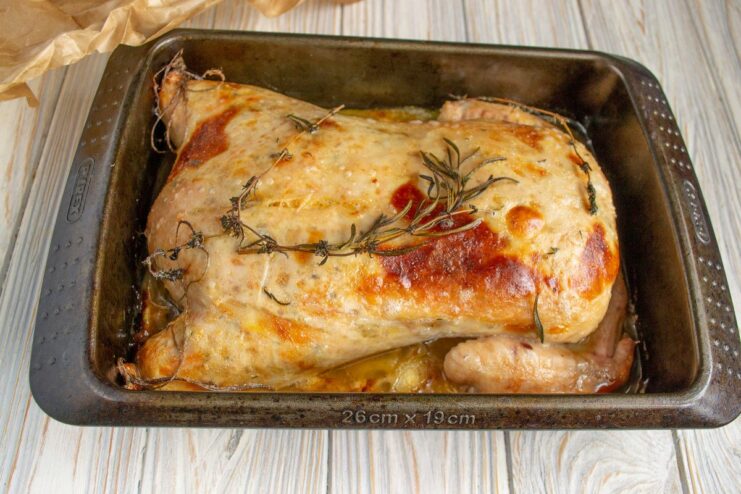 The perfectly roasted boneless stuffed chicken, golden and delicious The finished golden-brown boneless stuffed chicken in its baking dish.