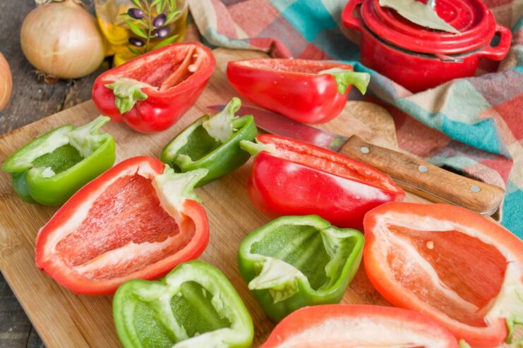 Preparing Bell Peppers for Stuffing Colorful bell peppers cut in half lengthwise, with seeds removed, ready for stuffing.