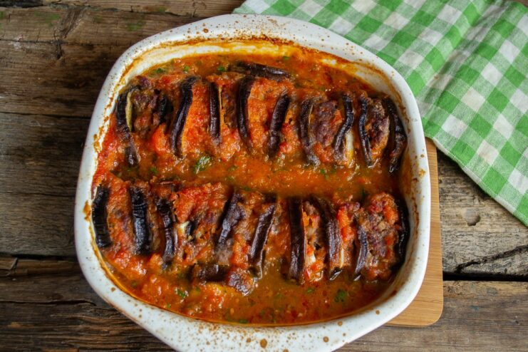 Bake for 45-50 Minutes and Enjoy! The finished baked beef and eggplant casserole, bubbling in the dish and garnished with cilantro.