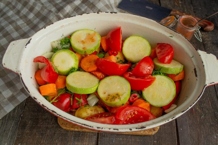 Adding Fresh Tomatoes for Juiciness Chopped fresh tomatoes added as a layer in the stew pot.