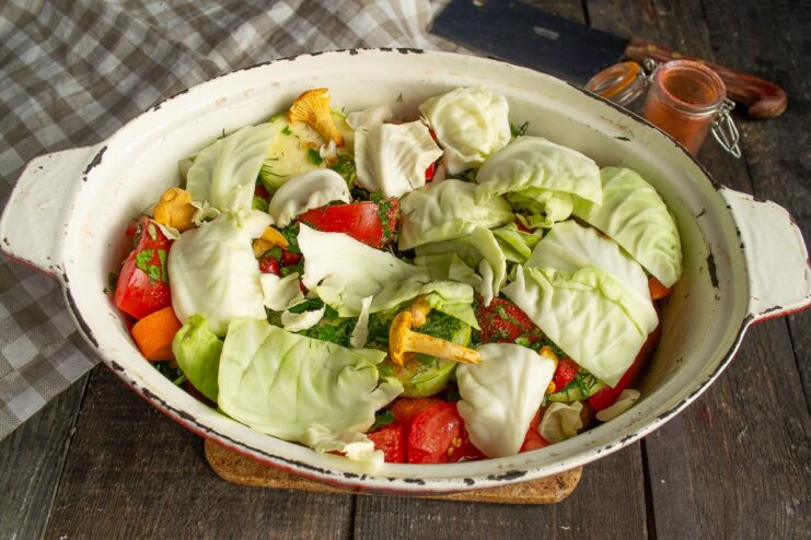 A Natural Lid: Using Cabbage Leaves to Trap Steam The stew ingredients in the pot being covered with large cabbage leaves.