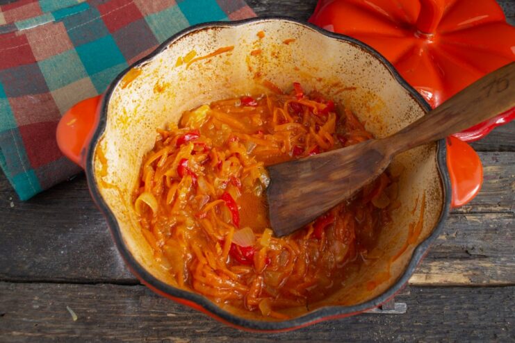 The rich vegetable sauce is ready for the meatballs A close-up of the cooked, thick vegetable sauce in a skillet.