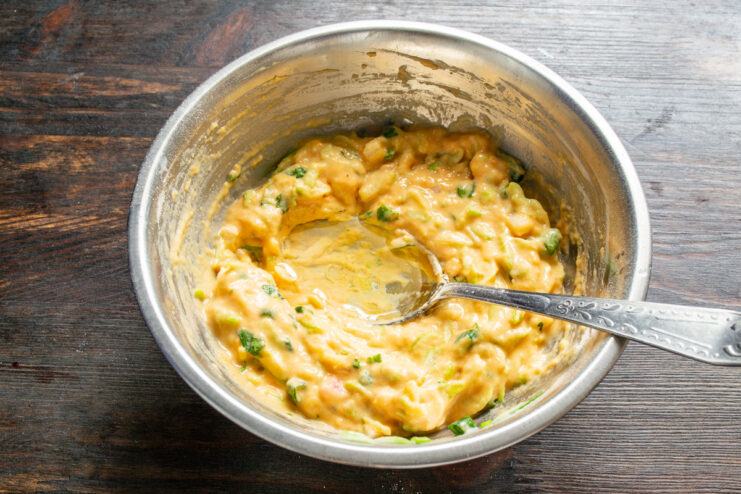 Letting the Fritter Batter Rest to Thicken A bowl with the finished zucchini and lentil flour batter, ready to rest.